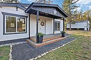 LOON LAKE HOME ON 5+ ACRES