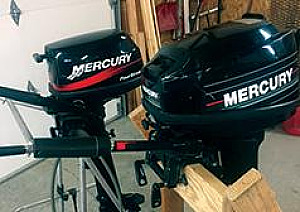 TWO OUTBOARD MOTORS