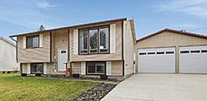 UPDATED GREENACRES HOME ON 1/4 ACRE WITH A SHOP!