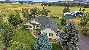 HOME ON NEARLY 10 ACRES WITH 2 SHOPS!