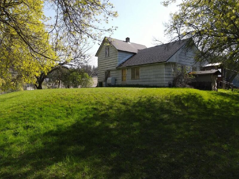 HOME IN STEVENS COUNTY ON 8 ACRES & TWO ORCHARDS!