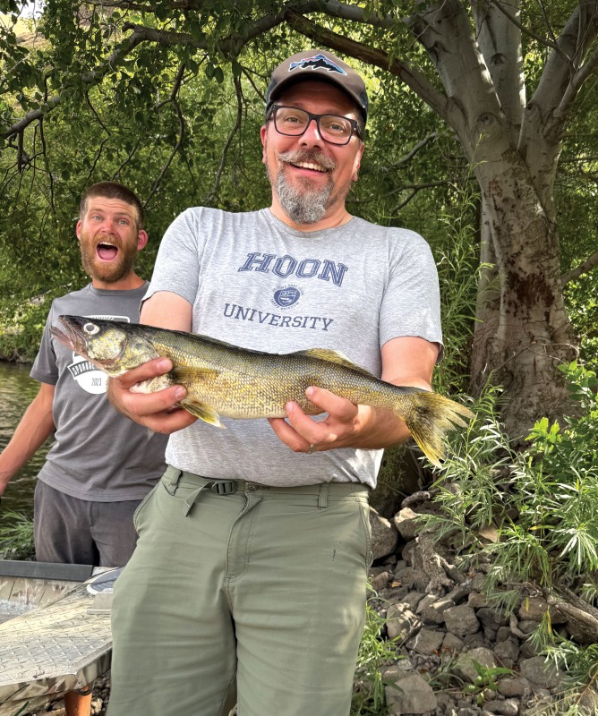 Brad and Logan with a Walleye