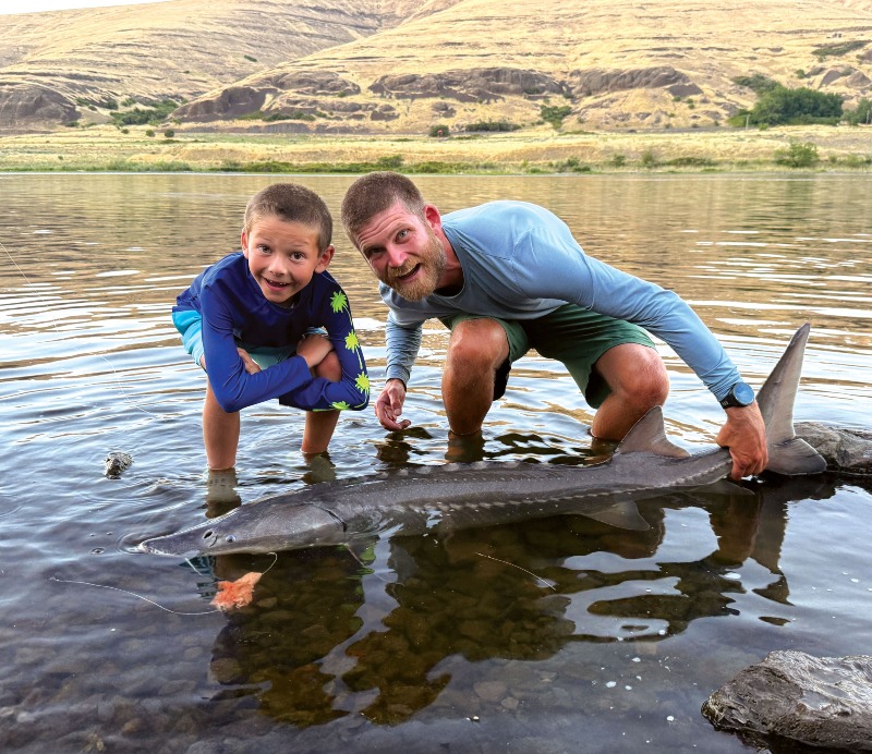 Dryden and Logan with a Sturgeon! WOW!