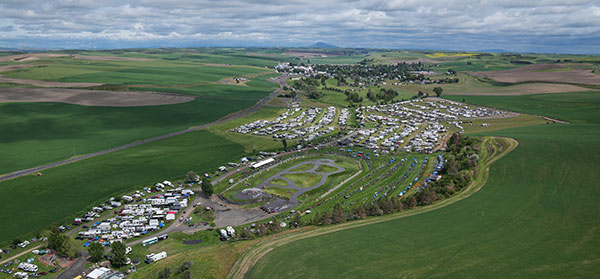 The aerial view of the Webbs Slough racetrack and the town of St. John in the distance
