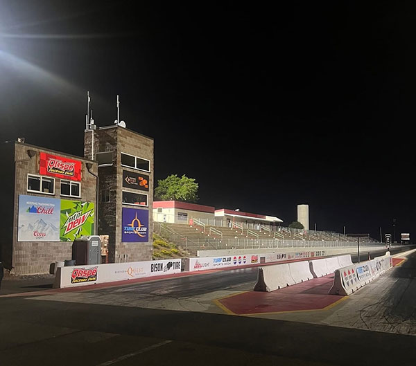 The nighttime view of the starting line under the new lighting fixtures. “Now you can see way past the finish line and into the long straight at turn 2 of the road course,” QRP operations manager Ben Zimmerman said.