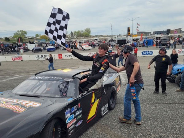 Zach Riehl exits his car following victory April 6 in the 56th annual Apple Cup at Tri City Raceway in West Richland, Wash. It was Riehl’s first Northwest Super Late Model Series victory