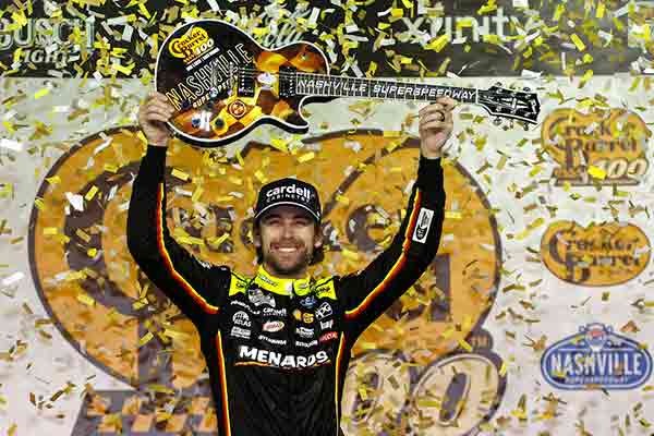 Ryan Blaney, driver of the #12 Menards/Cardell Cabinetry Ford, celebrates in victory lane after winning NASCAR Cup Series Cracker Barrel 400 at Nashville Superspeedway. 