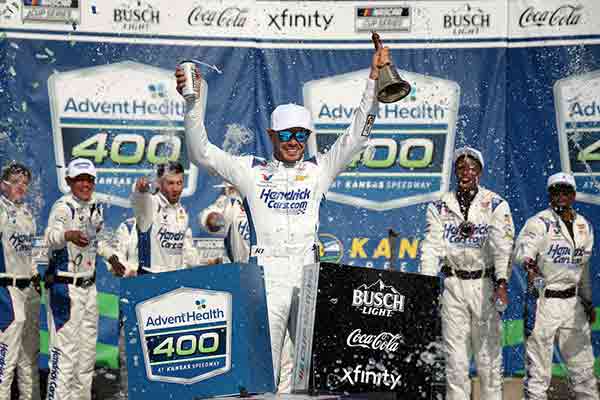Kyle Larson, driver of the #5 HendrickCars.com Chevrolet, celebrates in victory lane after winning the NASCAR Cup Series AdventHealth 400 at Kansas Speedway on May 11, 2025 in Kansas