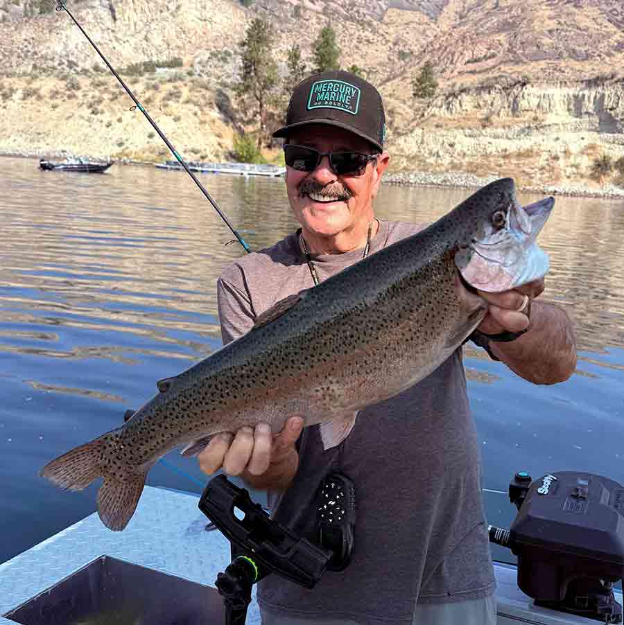 Dave Graybill holds a 5-pound triploid rainbow trout caught near the upper net pens at Rufus Woods Reservoir during a light-tackle fishing trip.