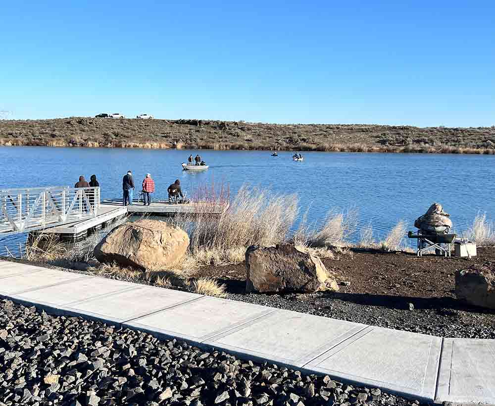 Anglers casting from shore and boat at Burke Lake on March 1st for Washington’s opening day trout season.