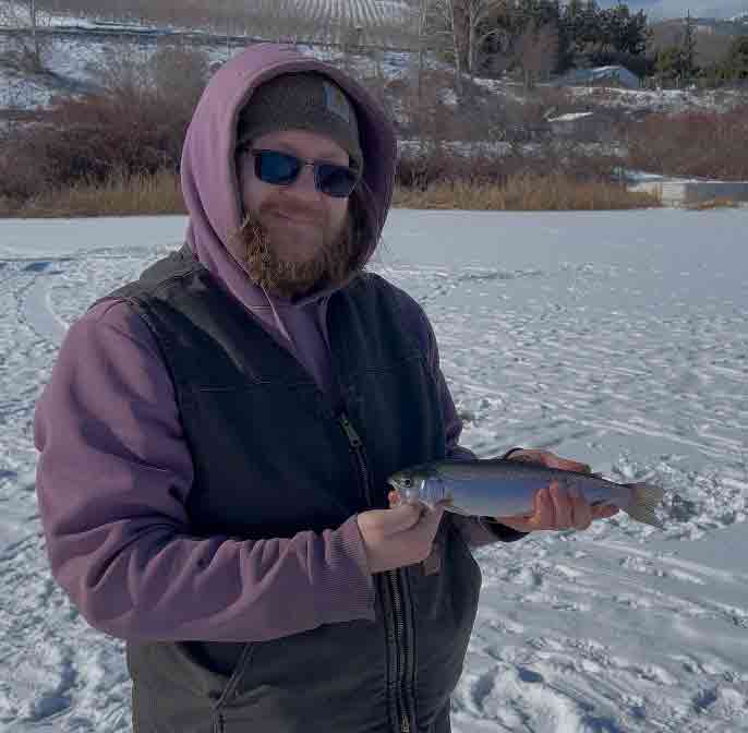 James Graybill and Dave Graybill hold up a pair of hefty triploid trout caught from shore at Rufus Woods Reservoir.