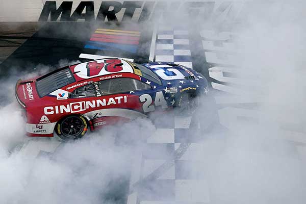 William Byron, driver of the #24 Cincinnati Chevrolet, celebrates with a burnout after winning the NASCAR Cup Series Xfinity 500 at Martinsville Speedway on October 26
